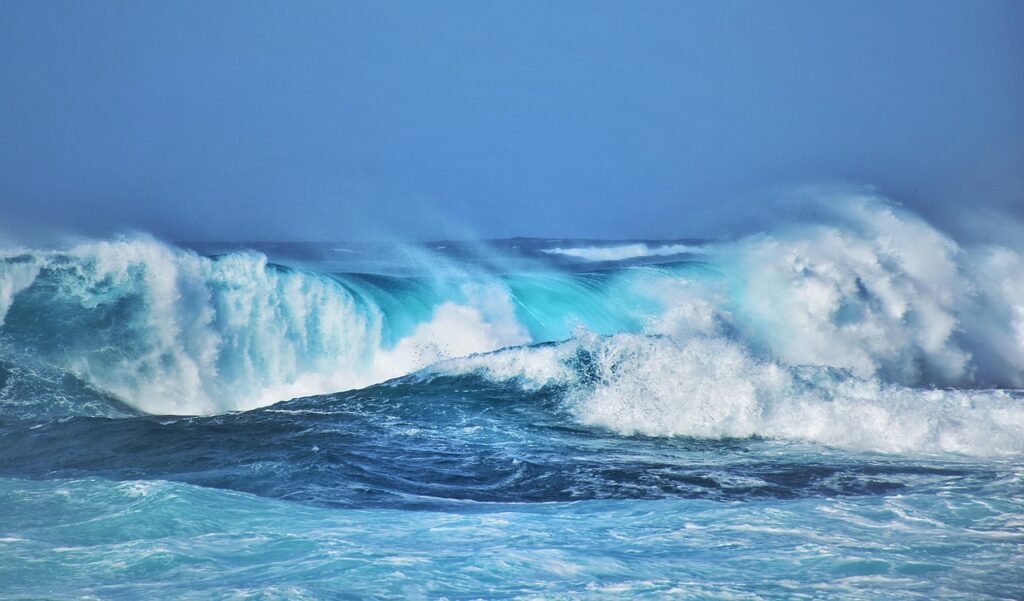 Ocean waves building across the sea – metaphor for feeling overwhelmed