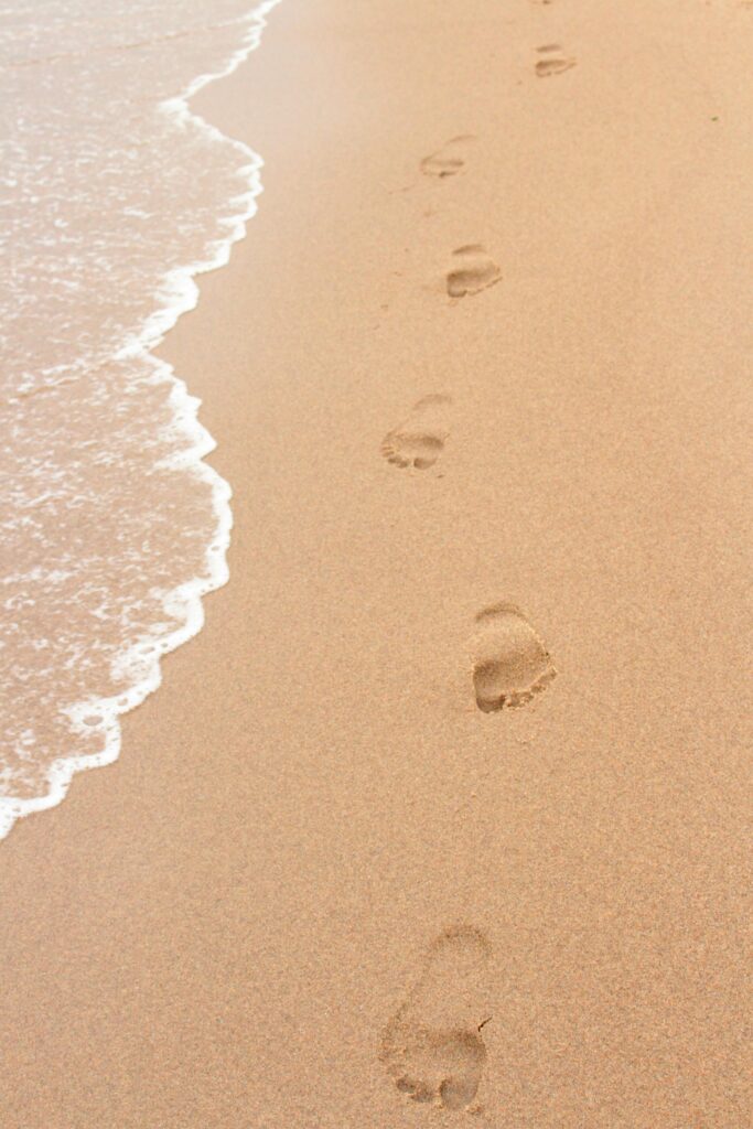 Footprints in sand symbolising behavioural patterns and repeated habits